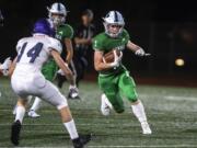 Mountain View’s Alec Cann runs the ball against Heritage during a game at McKenzie Stadium on Friday night, Sept 27, 2019.