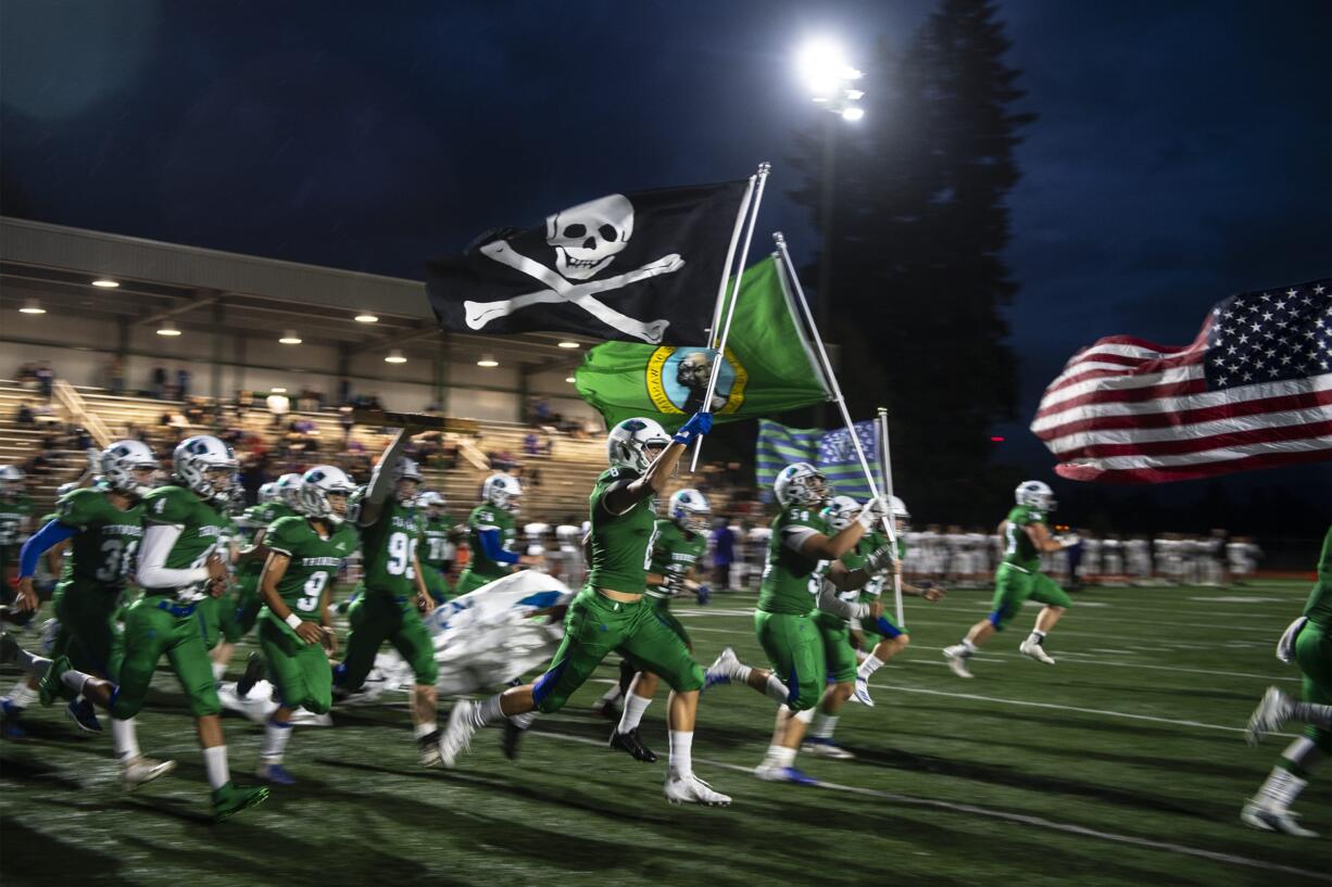 Mountain View runs onto the field before their game against Union at McKenzie Stadium on Friday night, Sept 27, 2019.