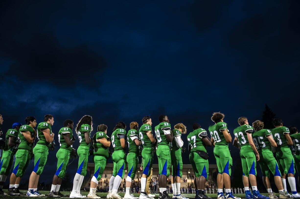 Mountain View lines up for the national anthem before their game against Heritage at McKenzie Stadium on Friday night, Sept 27, 2019.