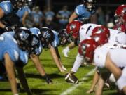 Hockinson and Archbishop Murphy face off at the line of scrimmage during Friday nightÕs game in Hockinson on Sept. 13, 2019. The HawkÕs lost 21-27.