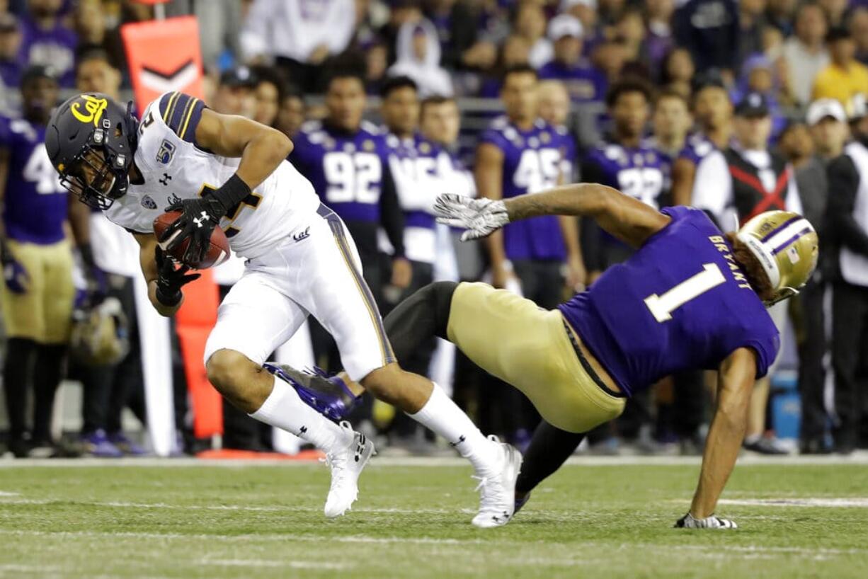 California cornerback Camryn Bynum, left, intercepts a pass intended for Washington tight end Hunter Bryant (1) during the first half of an NCAA college football game, Saturday, Sept. 7, 2019, in Seattle. (AP Photo/Ted S.