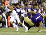 California cornerback Camryn Bynum, left, intercepts a pass intended for Washington tight end Hunter Bryant (1) during the first half of an NCAA college football game, Saturday, Sept. 7, 2019, in Seattle. (AP Photo/Ted S.