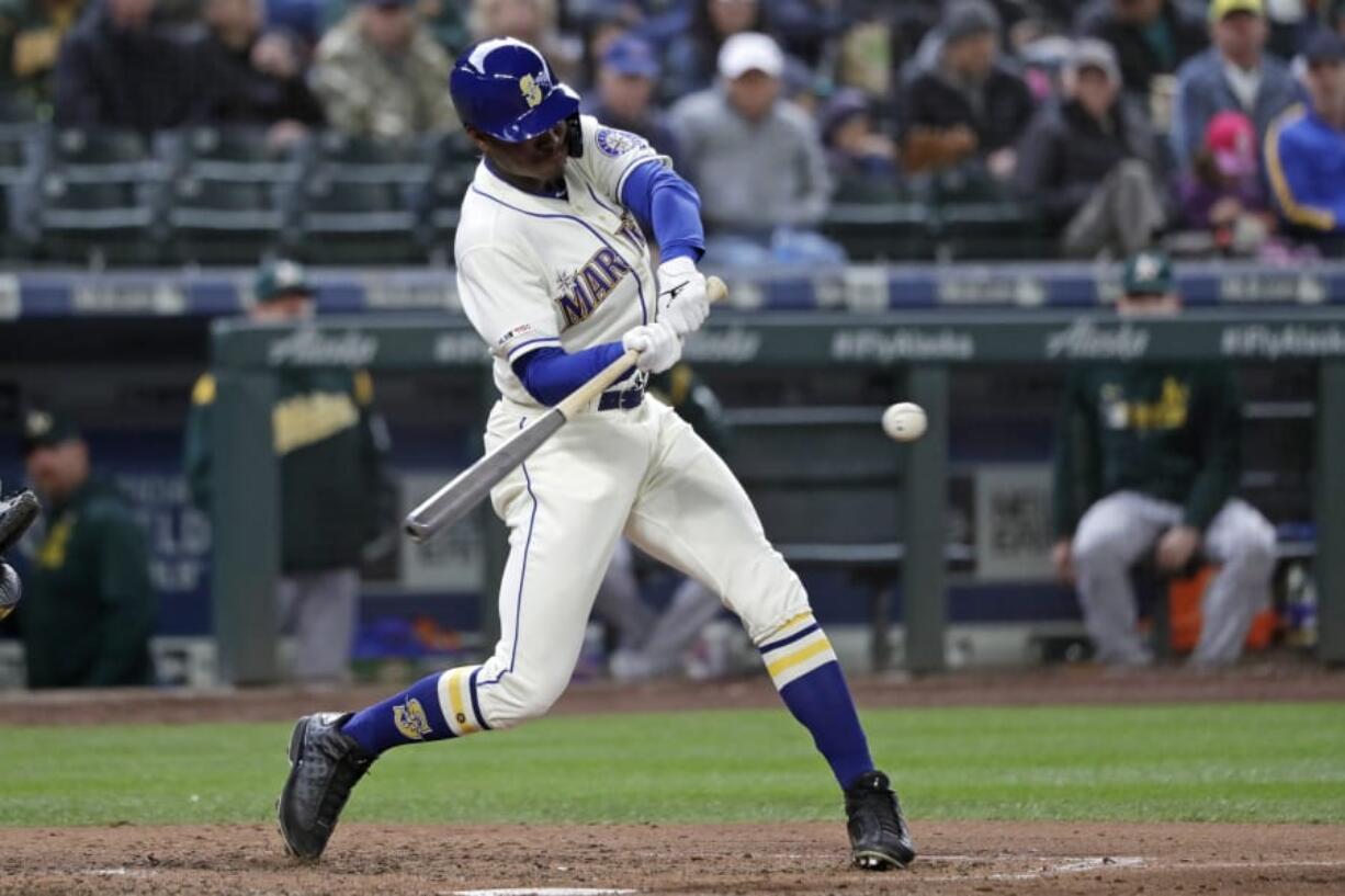 Seattle Mariners&#039; Kyle Lewis singles in a run against the Oakland Athletics in the fifth inning of a baseball game Sunday, Sept. 29, 2019, in Seattle.