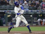 Seattle Mariners&#039; Kyle Lewis singles in a run against the Oakland Athletics in the fifth inning of a baseball game Sunday, Sept. 29, 2019, in Seattle.