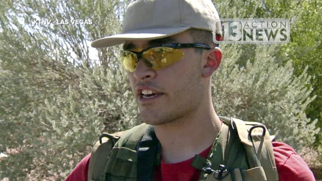 FILE - This Sept. 22, 2016 file photo from video from KTNV 13 Action News shows Conor Climo during an interview while walking a Las Vegas neighborhood, heavily armed. Climo, accused of assembling materials to bomb and shoot people at a synagogue, a bar catering to LGBTQ customers or a fast-food restaurant has been indicted on a federal firearm charge. Climo&#039;s appointed defense attorneys didn&#039;t immediately respond Tuesday, Sept. 17, 2019 to messages about the indictment filed Sept. 11 in U.S. District Court in Nevada.