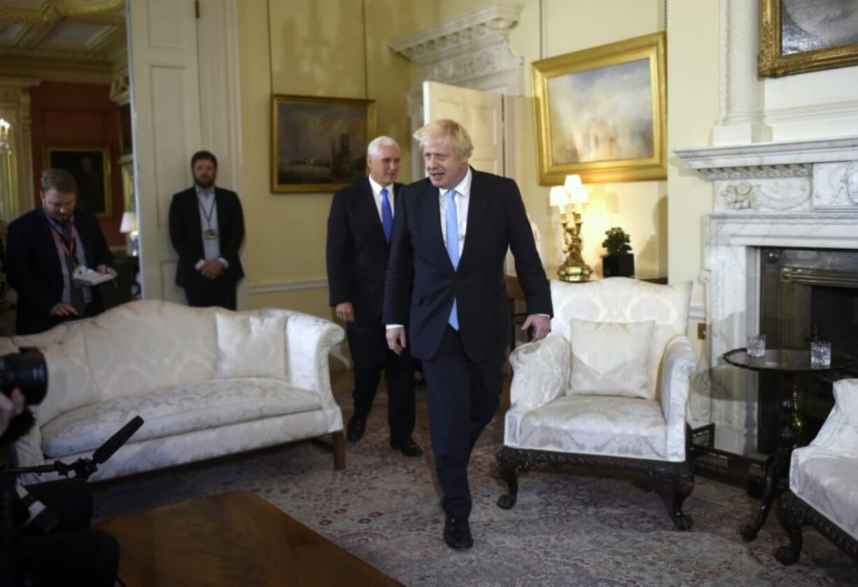 Britain’s Prime Minister Boris Johnson, front, meets with US Vice President Mike Pence inside 10 Downing Street in London, Thursday, Sept. 5, 2019.