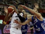 Japan’s Rui Hachimura keeps the ball from Czech Republic’s Martin Kriz during a Group E match for the FIBA Basketball World Cup at the Shanghai Oriental Sports Center in Shanghai on Tuesday, Sept. 3, 2019.