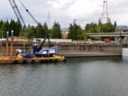 A U.S. Army Corps of Engineers photo shows the Bonneville Lock on Sunday with temporary barriers in place to allow it to be drained. With the lock closed, barges that shuttle millions of tons of wheat, wood and other inland goods to the Pacific Ocean for transport to Asia can’t move. It’s not clear when repairs will be complete. Megan Innes/U.S.