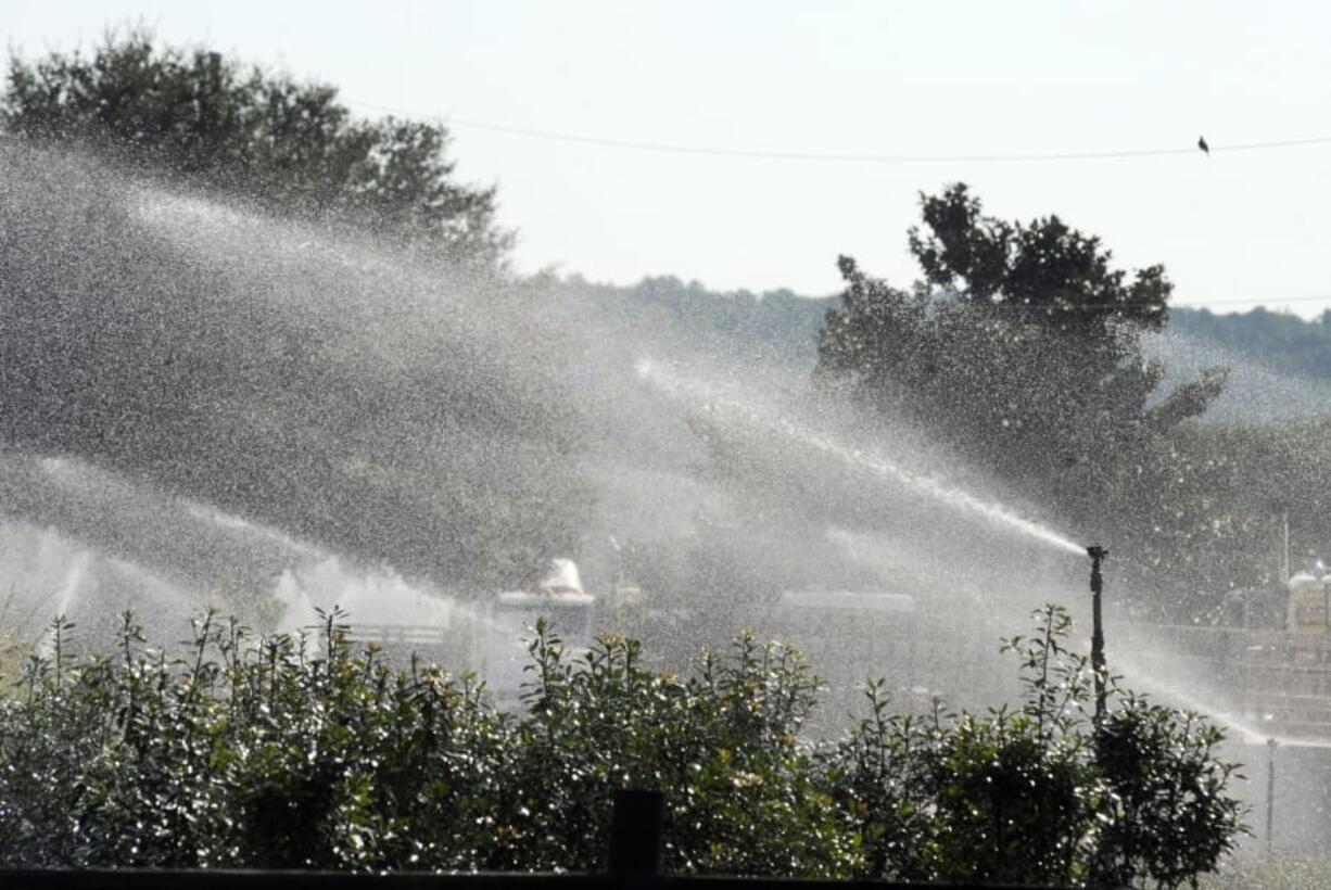 Sprinklers spray water on plants at Green Valley Farms, a commercial nursery in Montevallo, Ala., on Thursday, Sept. 26, 2019. Weeks of dry, hot weather across the Deep South have worsened a drought that a federal assessment says is affecting more than 11 million people across five states.