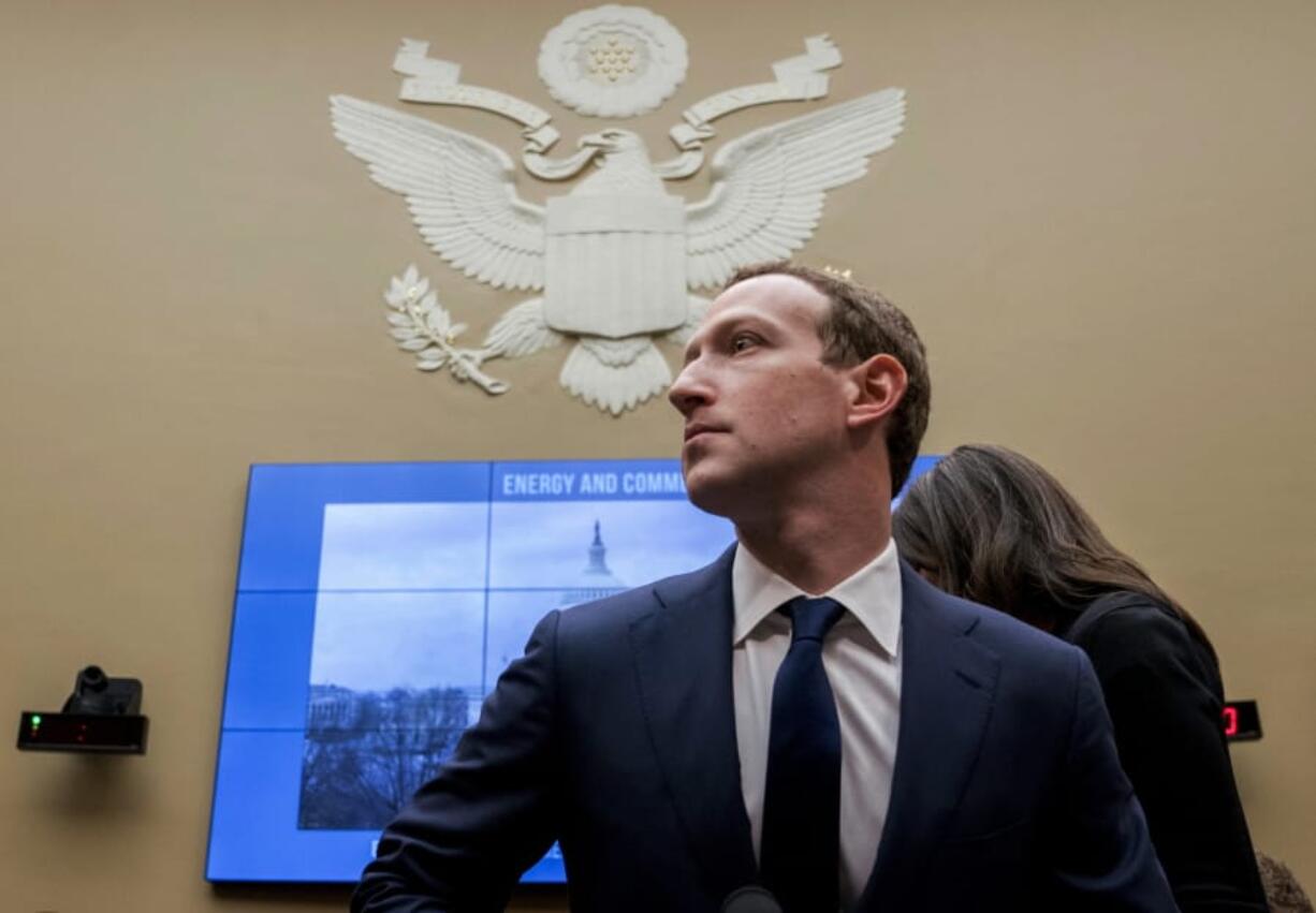 FILE - In this April 11, 2018, file photo, Facebook CEO Mark Zuckerberg arrives to testify before a House Energy and Commerce hearing on Capitol Hill in Washington. Facebook said Tuesday, Sept. 17, 2019, that it expects to name the first members of a new quasi-independent oversight board by year-end. The oversight panel, which the social network first discussed publicly last November, will rule on thorny content issues, such as when Facebook or Instagram posts constitute hate speech.