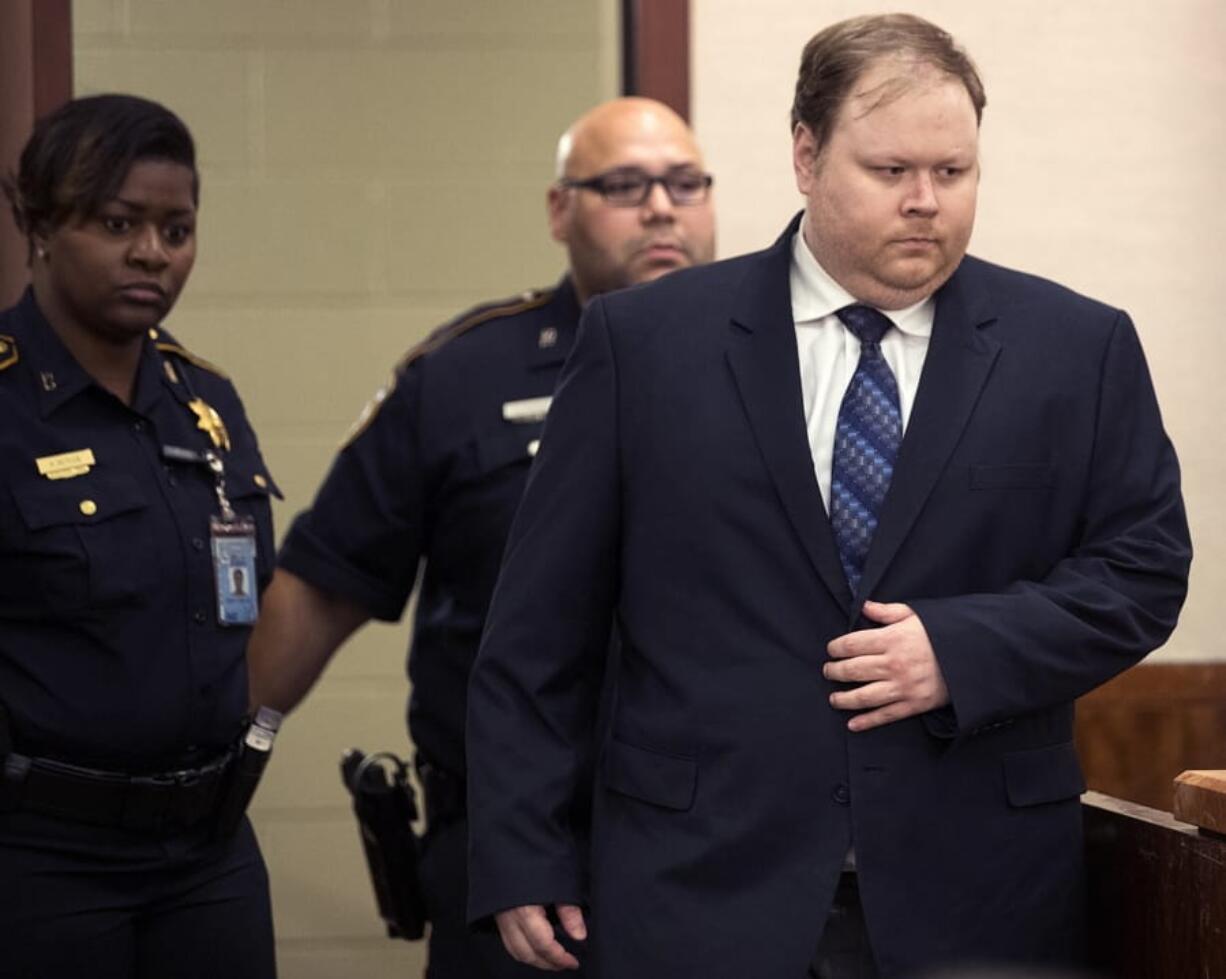 Ronald Haskell is led into the courtroom to hear the verdict in his capital murder trial Thursday in Houston. He was found guilty by a jury that rejected his insanity defense.