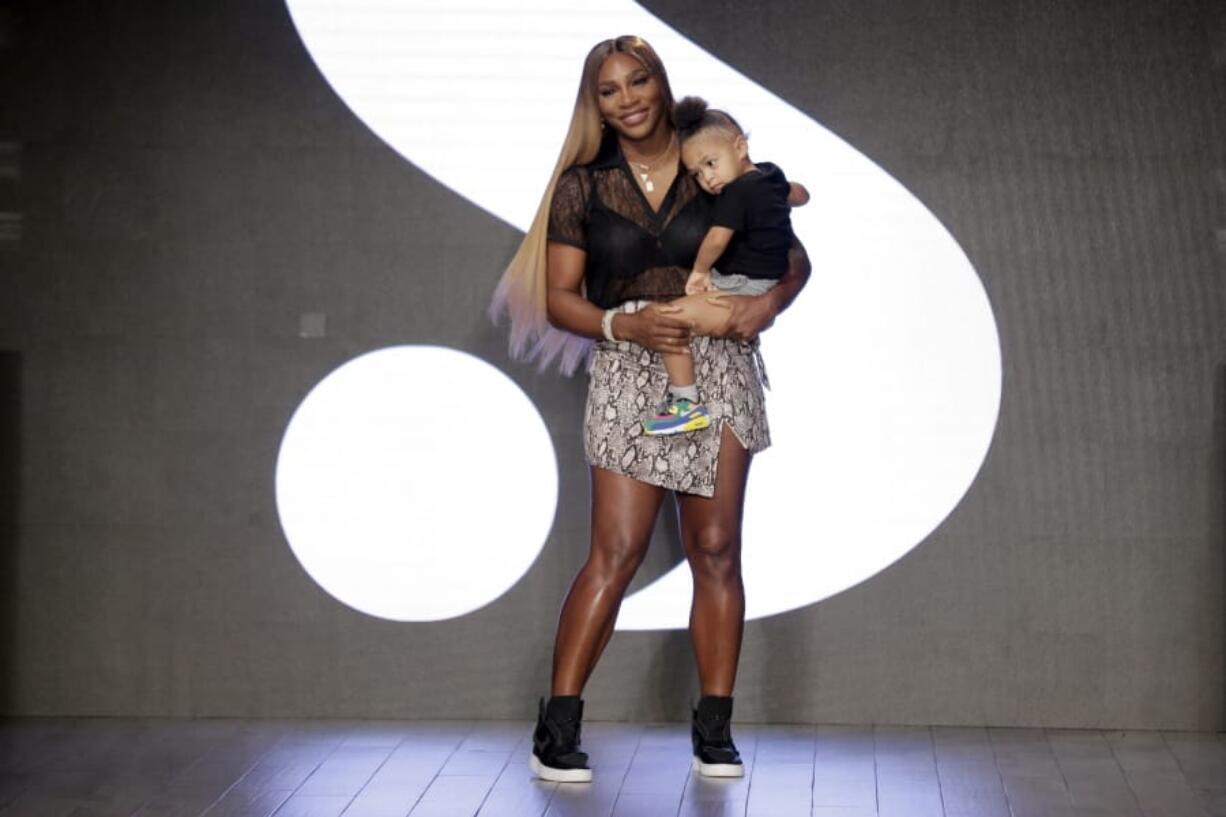 Serena Williams holds her daughter Alexis Olympia Ohanian Jr. after showing her clothing line Tuesday during New York’s Fashion Week.