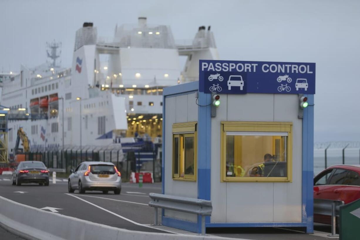 A French custom officer works in a booth at the transit zone at the port of Ouistreham, Normandy, Thursday, Sept.12, 2019. France has trained 600 new customs officers and built extra parking lots arounds its ports to hold vehicles that will have to go through extra checks if there is no agreement ahead of Britain’s exit from the EU, currently scheduled on Oct. 31.