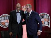 Inductee Jack Sikma, right, stands with presenter Kareem Abdul-Jabbar at the Basketball Hall of Fame enshrinement ceremony Friday, Sept. 6, 2019, in Springfield, Mass.