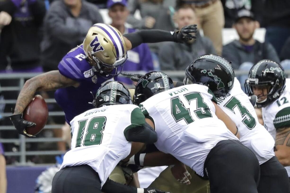 Washington quarterback Jacob Eason passes against Hawaii during the first half of an NCAA college football game, Saturday, Sept. 14, 2019, in Seattle. (AP Photo/Ted S.