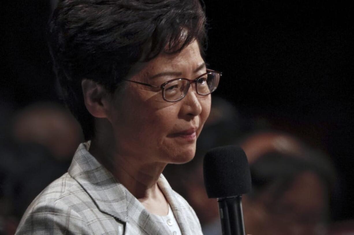 Hong Kong Chief Executive Carrie Lam speaks during a community dialogue with selected participants at the Queen Elizabeth Stadium in Hong Kong, Thursday, Sept. 26, 2019. Scores of protesters chanted slogans outside a stadium in downtown Hong Kong as embattled city leader Carrie Lam began a town hall session Thursday aimed at cooling down months of demonstrations for greater democracy in the semi-autonomous Chinese territory.