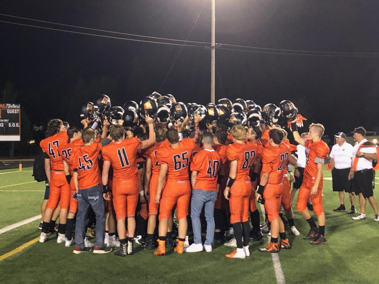 The Washougal football team gathers after its 40-0 win over Hudson's Bay on Friday in Washougal (Micah Rice/The Columbian)