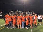 The Washougal football team gathers after its 40-0 win over Hudson's Bay on Friday in Washougal (Micah Rice/The Columbian)