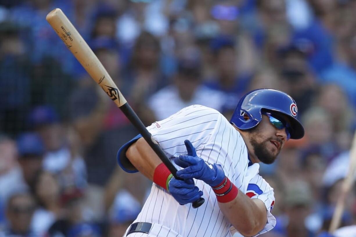 Chicago Cubs’ Kyle Schwarber hits a three-run triple against the Seattle Mariners during the seventh inning of a baseball game Monday, Sept. 2, 2019, in Chicago.