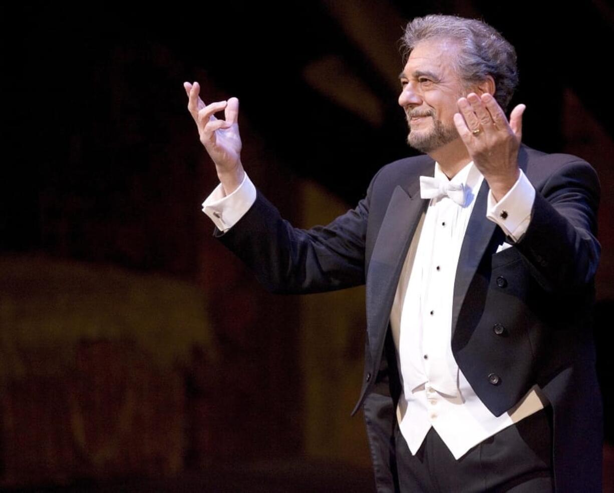 FILE - This May 20, 2006 file photo shows Placido Domingo acknowledging applause after performing at the Metropolitan Opera Gala honoring general manager Joseph Volpe in New York. Domingo has agreed to withdraw from all future performances at the Metropolitan Opera following accusations of sexual harassment made by women in a pair of reports by The Associated Press. The 78-year-old classical music star had been scheduled to sing the title role in the season debut of Verdi&#039;s &quot;Macbeth&quot; on Wednesday night, which would have been his first performance in the United States since the reports.