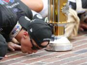 Kevin Harvick kisses the yard of bricks on the finish line after winning the NASCAR Brickyard 400 auto race at Indianapolis Motor Speedway, Sunday, Sept. 8, 2019, in Indianapolis.