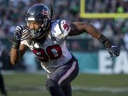 FILE - In this Dec. 23, 2018, file photo, Houston Texans’ Jadeveon Clowney rushes during an NFL football game against the Philadelphia Eagles in Philadelphia. Houston added six players in four trades this weekend, which included a deal that sent 2014 top overall pick Clowney to the Seattle Seahawks after the team could not agree on a long-term deal with the defensive end.