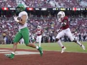 Oregon tight end Jacob Breeland (27) scores a touchdown past Stanford safety Malik Antoine (3) during the second half of an NCAA college football game on Saturday, Sept. 21, 2019, in Stanford, Calif.