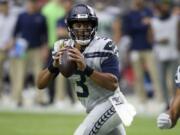 Seattle Seahawks quarterback Russell Wilson (3) looks to throw against the Arizona Cardinals during the second half of an NFL football game, Sunday, Sept. 29, 2019, in Glendale, Ariz. (AP Photo/Ross D.