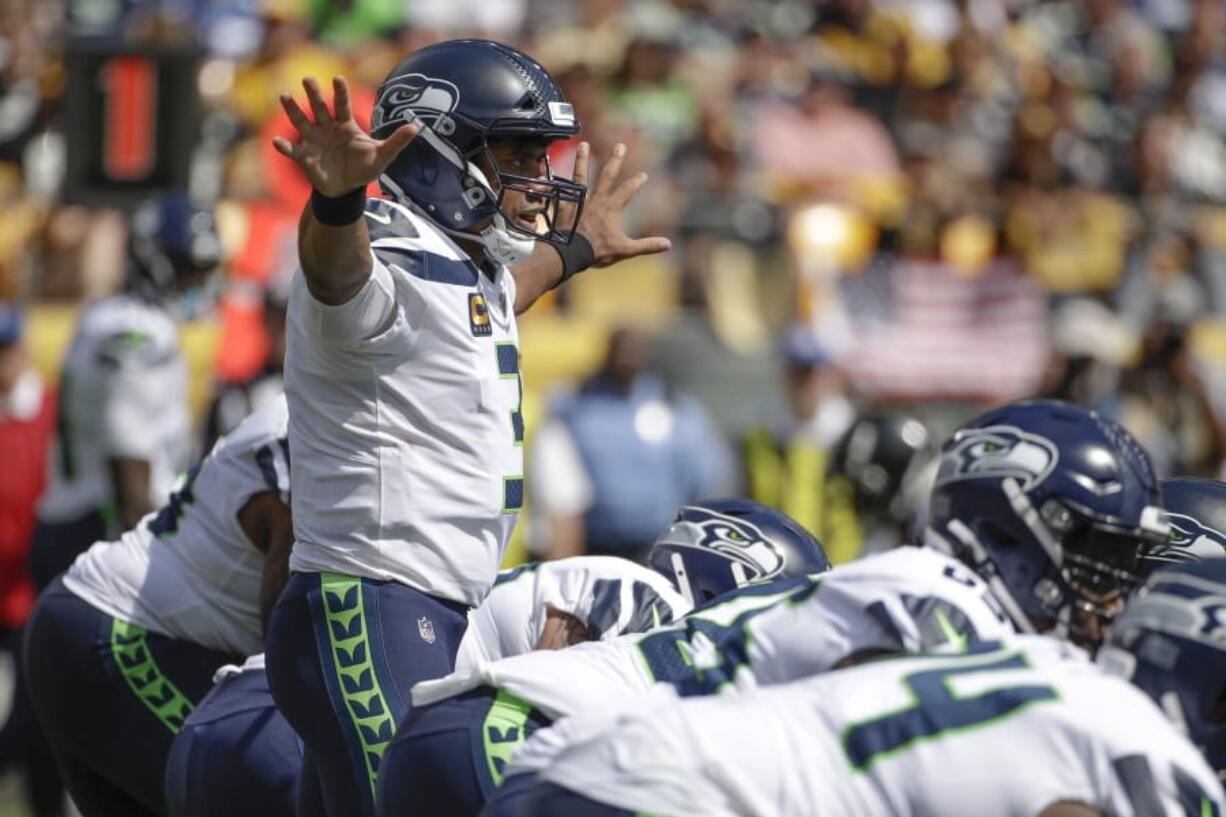 Seattle Seahawks quarterback Russell Wilson (3) calls signals against the Pittsburgh Steelers in the first half of an NFL football game, Sunday, Sept. 15, 2019, in Pittsburgh. (AP Photo/Gene J.