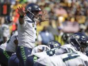 Seattle Seahawks quarterback Russell Wilson (3) calls signals against the Pittsburgh Steelers in the first half of an NFL football game, Sunday, Sept. 15, 2019, in Pittsburgh. (AP Photo/Gene J.