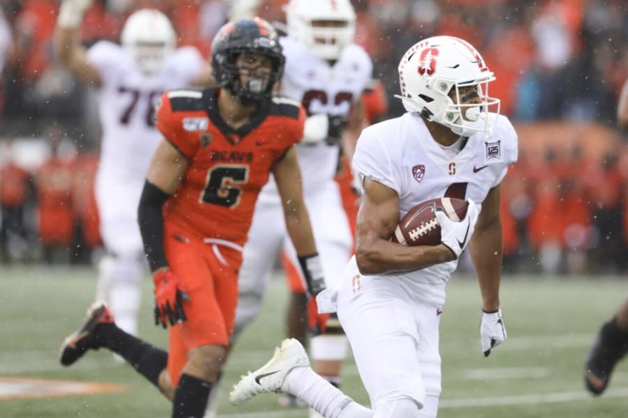 CORRECTS TO SATURDAY NOT FRIDAY  - Stanford wide receiver Michael Wilson, foreground, scores a touchdown off a pass from quarterback Davis Mills during the first half of an NCAA college football game against Oregon State in Corvallis, Ore., Saturday, Sept. 28, 2019.