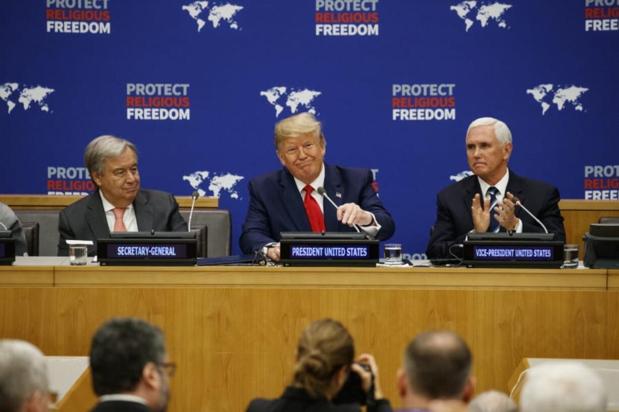 United Nations Secretary General Antonio Guterres, left, and Vice President Mike Pence, right, listen as President Donald Trump speaks at an event on religious freedom Monday during the United Nations General Assembly in New York.