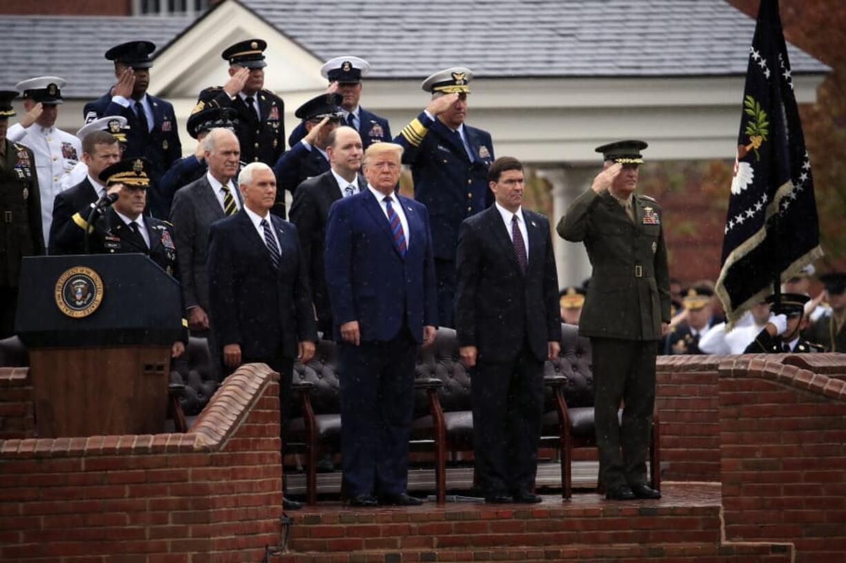 President Donald Trump participates in an Armed Forces welcome ceremony for the new chairman of the Joint Chiefs of Staff, Gen. Mark Milley, left, Monday, Sept. 30, 2019, at Joint Base Myer-Henderson Hall, Va. From left are Chairman of the Joint Chiefs of Staff, Gen. Mark Milley, Vice President Mike Pence, Trump, Secretary of Defense Mark Esper and Gen.