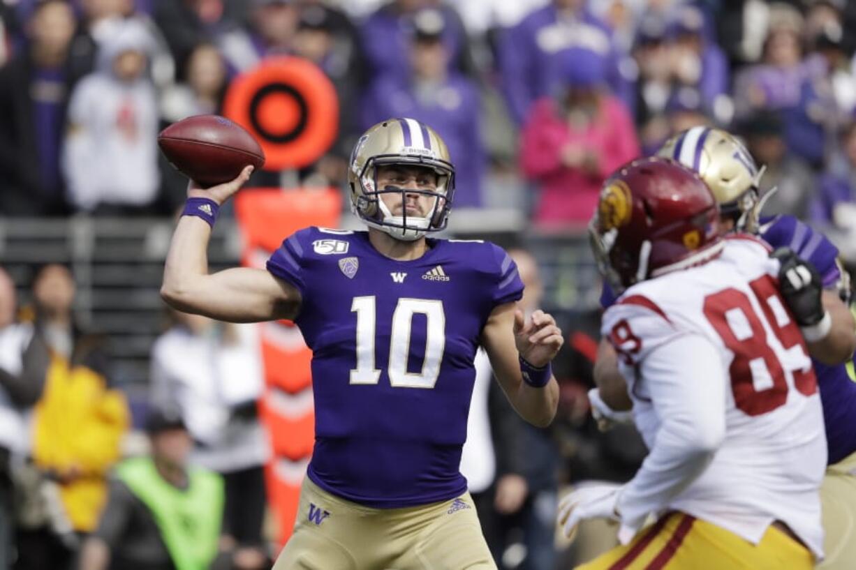 Washington quarterback Jacob Eason sets up to pass against Southern Cal in the first half of an NCAA college football game Saturday, Sept. 28, 2019, in Seattle.