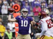 Washington quarterback Jacob Eason sets up to pass against Southern Cal in the first half of an NCAA college football game Saturday, Sept. 28, 2019, in Seattle.