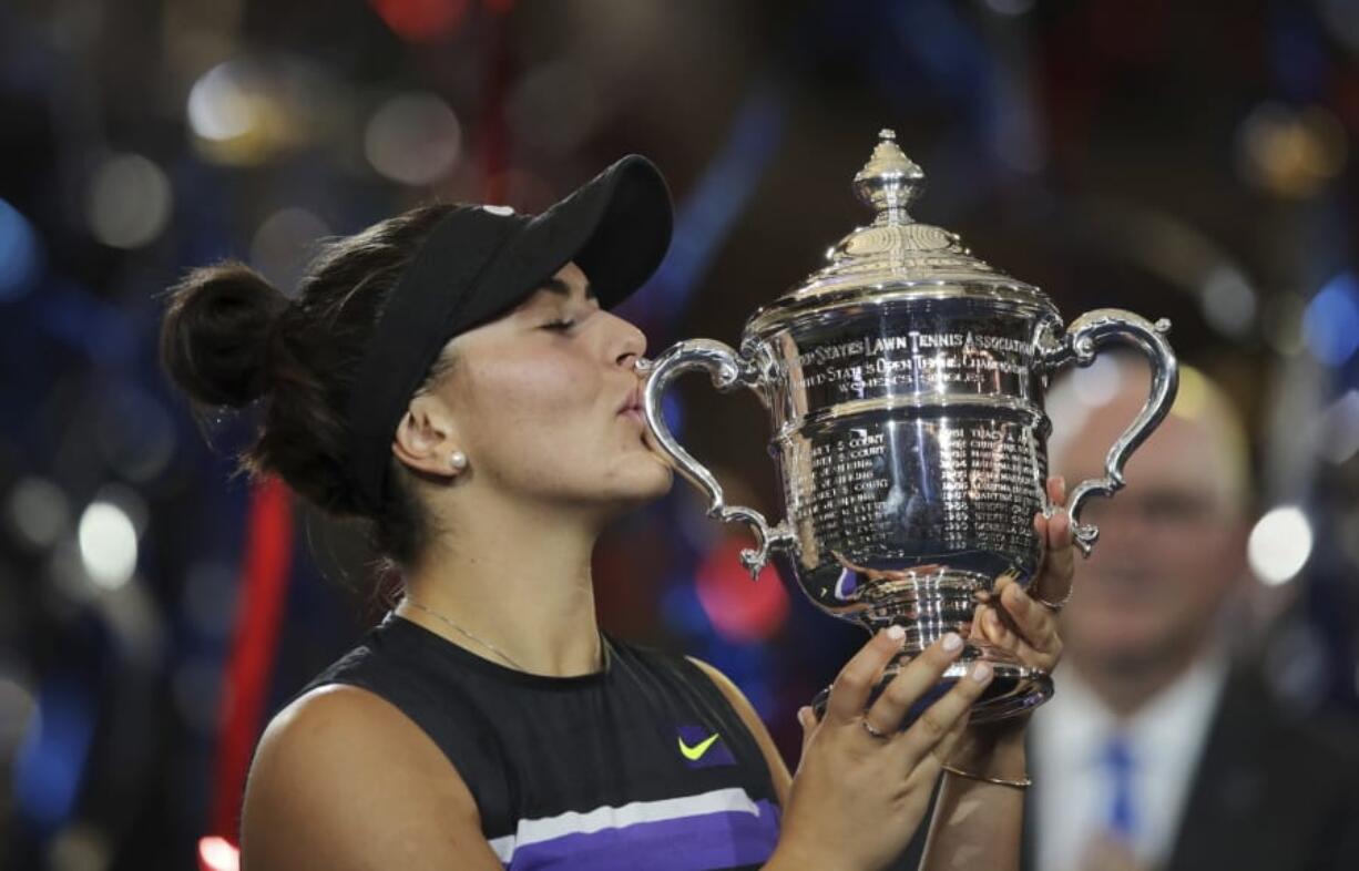 Bianca Andreescu, of Canada, kisses the championship trophy after defeating Serena Williams, of the United States, in the women’s singles final of the U.S. Open tennis championships Saturday, Sept. 7, 2019, in New York.