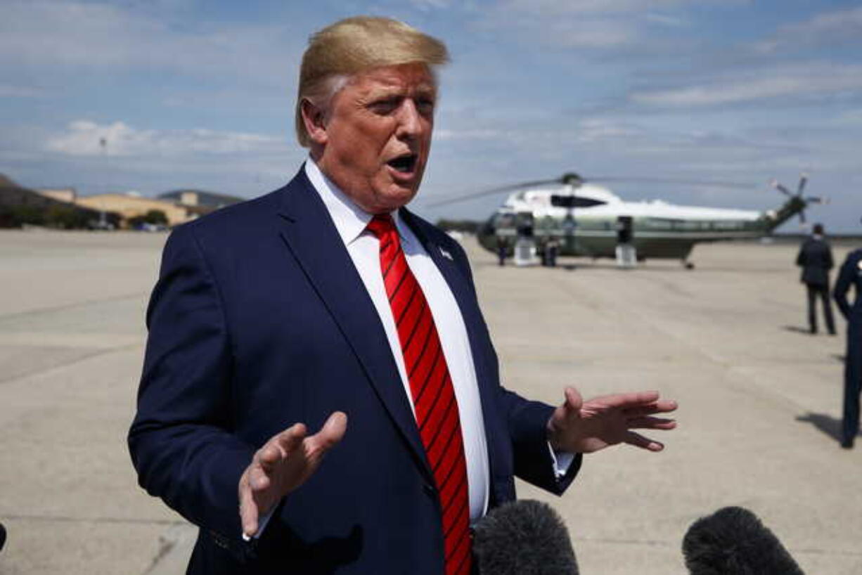 President Donald Trump talks with reporters after arriving at Andrews Air Force Base, Thursday, Sept. 26, 2019, in Andrews Air Force Base, Md.Trump had spent the week attending the United Nations General Assembly in New York.