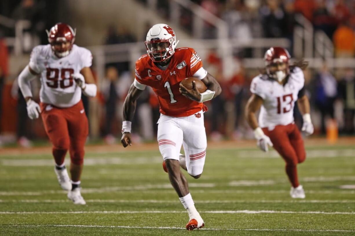 Utah quarterback Tyler Huntley (1) carries the ball against Washington State in the first half of an NCAA college football game Saturday, Sept. 28, 2019, in Salt Lake City.