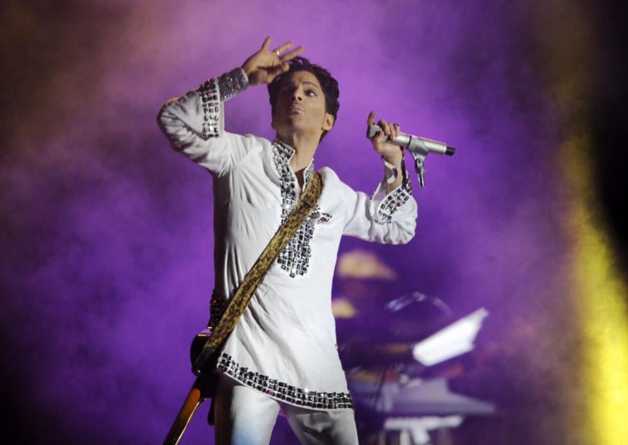 FILE - In this April 26, 2008 file photo, Prince performs during his headlining set on the second day of the Coachella Valley Music and Arts Festival in Indio, Calif. Prince’s estate will take over management of the late rock star’s studio complex near Minneapolis. Graceland Holdings, which runs Elvis Presley’s tourist attraction in Memphis, Tennessee, had been operating Prince’s Paisley Park in Chanhassen as a museum since October 2016.