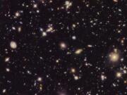 This image made available by the European Space agency shows galaxies in the Hubble Ultra Deep Field 2012, an improved version of the Hubble Ultra Deep Field image. A study from the Max Planck Institute in Germany published Thursday, Sept. 12, 2019, in the journal Science uses a new technique to come up with a rate that the universe is expanding that is nearly 18% higher than the number scientists had been using since the year 2000. (NASA, ESA, R.