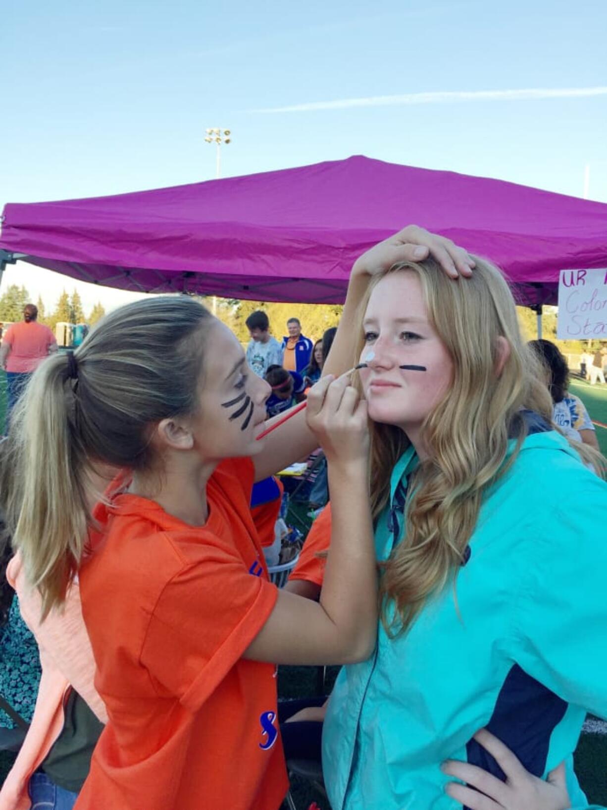 Lilly Ziemer, left, and Audrie Chapman at a past Experience Ridgefield, a carnival organized by students in the district celebrating the city. This year’s event will be held Sept. 14 in conjunction with Ridgefield’s Oktoberfest celebration.