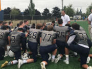 Seton Catholic head coach Dan Chase addresses the Cougars after their season-opening 19-8 victory Saturday over Chimacum.