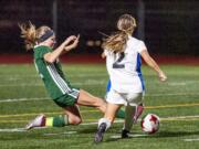 Evergreen?s Maddie Harris perfectly times her slide tackle to rid the ball from Mountain View?s Kylie Ellett in the Plainsmen?s 1-0 3A GSHL win on Tuesday at McKenzie Stadium.