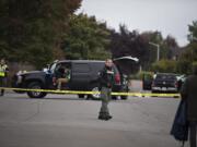 Officials work at the scene of a fatal crash in east Vancouver involving a pickup truck and a child on a bicycle Tuesday morning. The Clark County Medical Examiner's Office identified the boy as Damien T. Vandecasteele, 10.