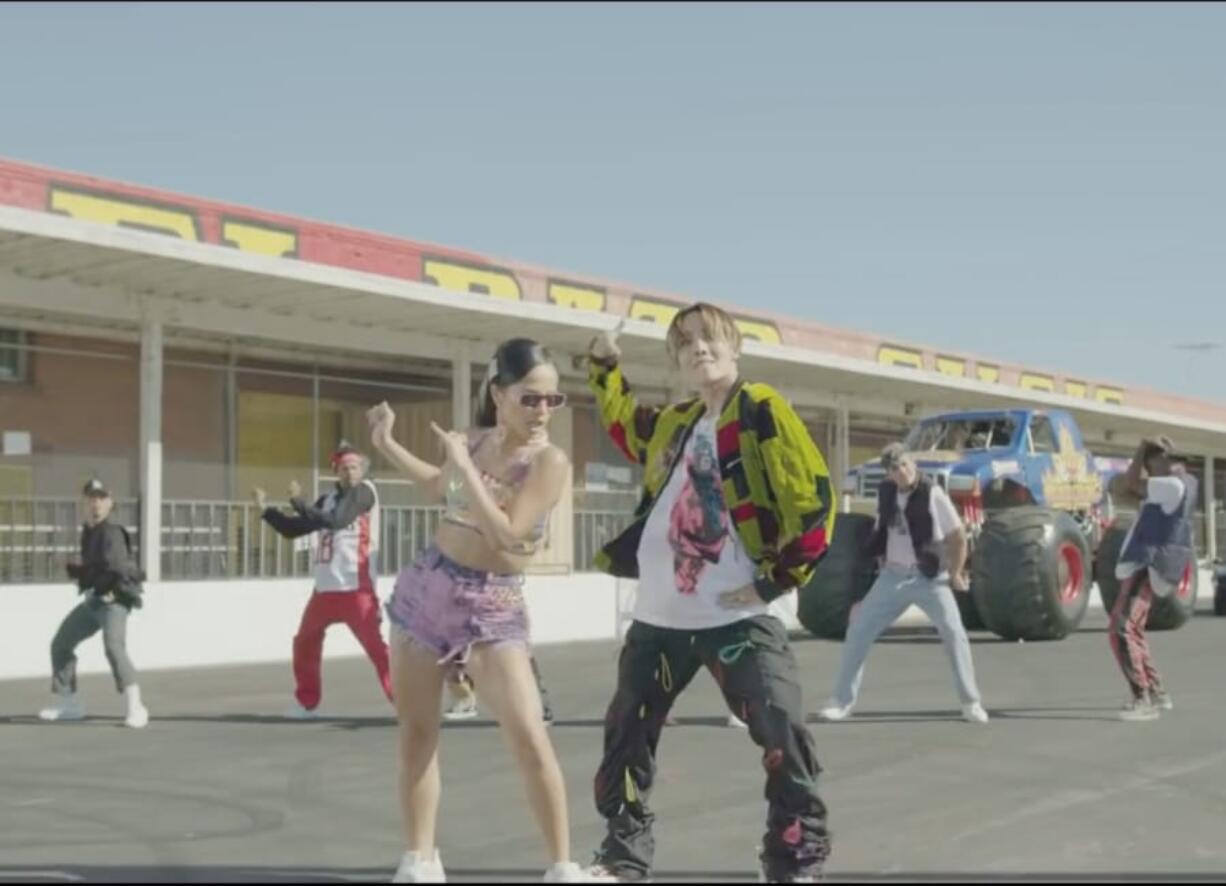 Becky G, left, and J-Hope in the music video for their collaboration &quot;Chicken Noodle Soup.&quot; (ibighit/YouTube)