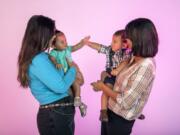 Jessica Joachims holds her daughter, Sonora Storm Hayes, 9 months, and Naomi Allen holds her son, Gabriel Storm Allen, 10 months. Joachims and Allen both had children after starting breast cancer treatment, which is a rare occurrence.