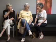 Lyn Farr, from left, Dorie Dageforde and Marian Sandler catch up before September's general meeting of the Clark County Newcomers Club at the YWCA Clark County.