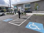 Helen Engel of Vancouver checks out the wheelchair-accessible parking spaces across from Twigs Bistro and Martini Bar at The Waterfront Vancouver.