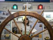 Isabel Alanis, 12, takes notes on the historic steering wheel from a Columbia River ferry during an Odyssey Middle School class visit to the Clark County Historical Museum's new "Currents of Progress" exhibit.