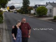 Cheryl and Ken Lickar pose for a photo near their home in Cascade Parks Estates, a 55-and-older manufactured home community where monthly rent is increasing $125 on Jan. 1.